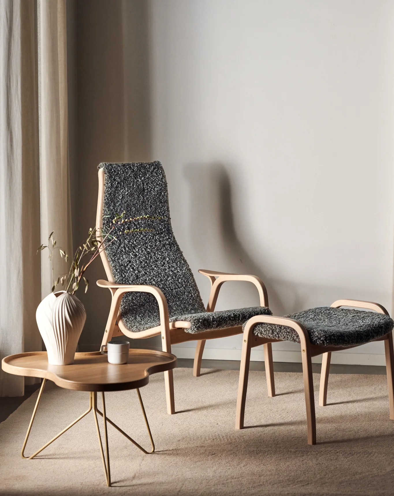 Lamino armchair and footstool varnished beech/sheepskin, Scandinavian Grey Swedese