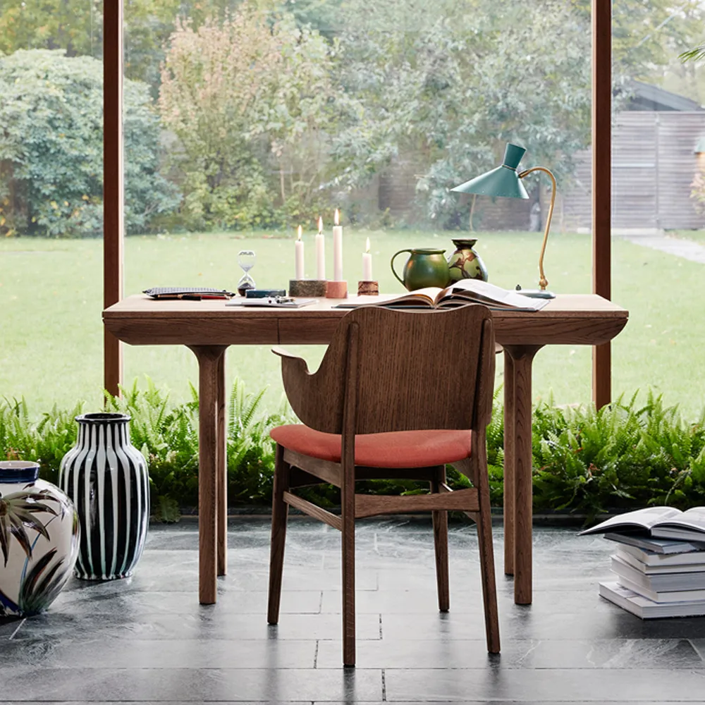 Gesture chair, upholstered seat and back, Fabric rusty rosé, leather backrest, black lacquered beech legs Warm Nordic