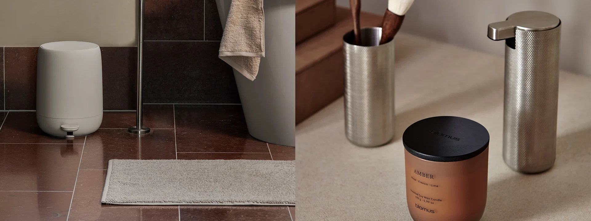 Brown marble bathroom vanity with a black faucet, grey towel, and black accessories. A black shelf above holds black bottles. On the right, a copper candle and silver dispensers.