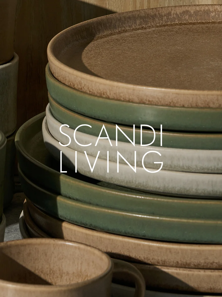 Earthy-toned ceramic plates stacked with a mug, featuring 'SCANDI LIVING' text overlay.