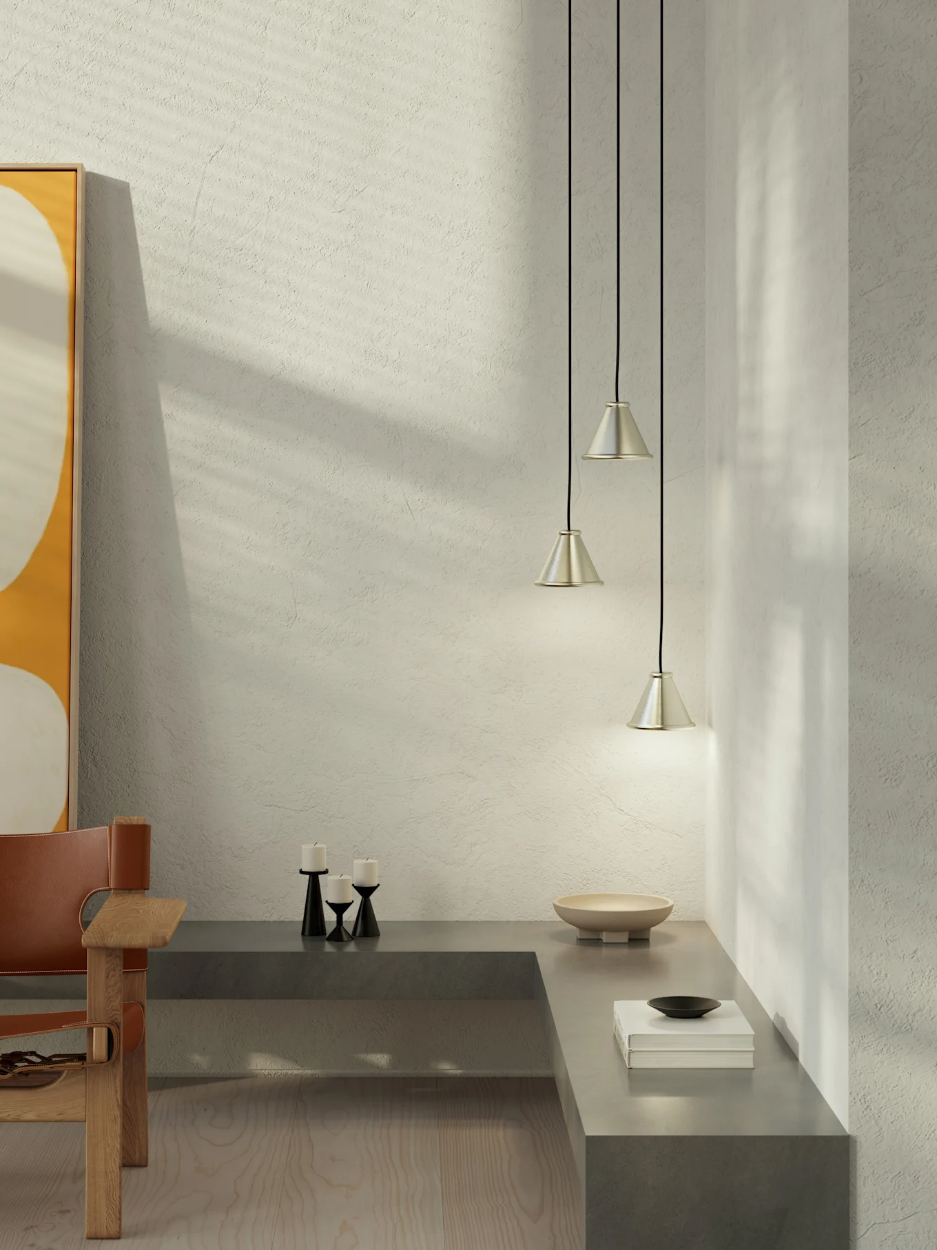 Modern minimalist room: textured wall, sunlit shadows, abstract art, concrete bench with decor, three silver pendant lights.