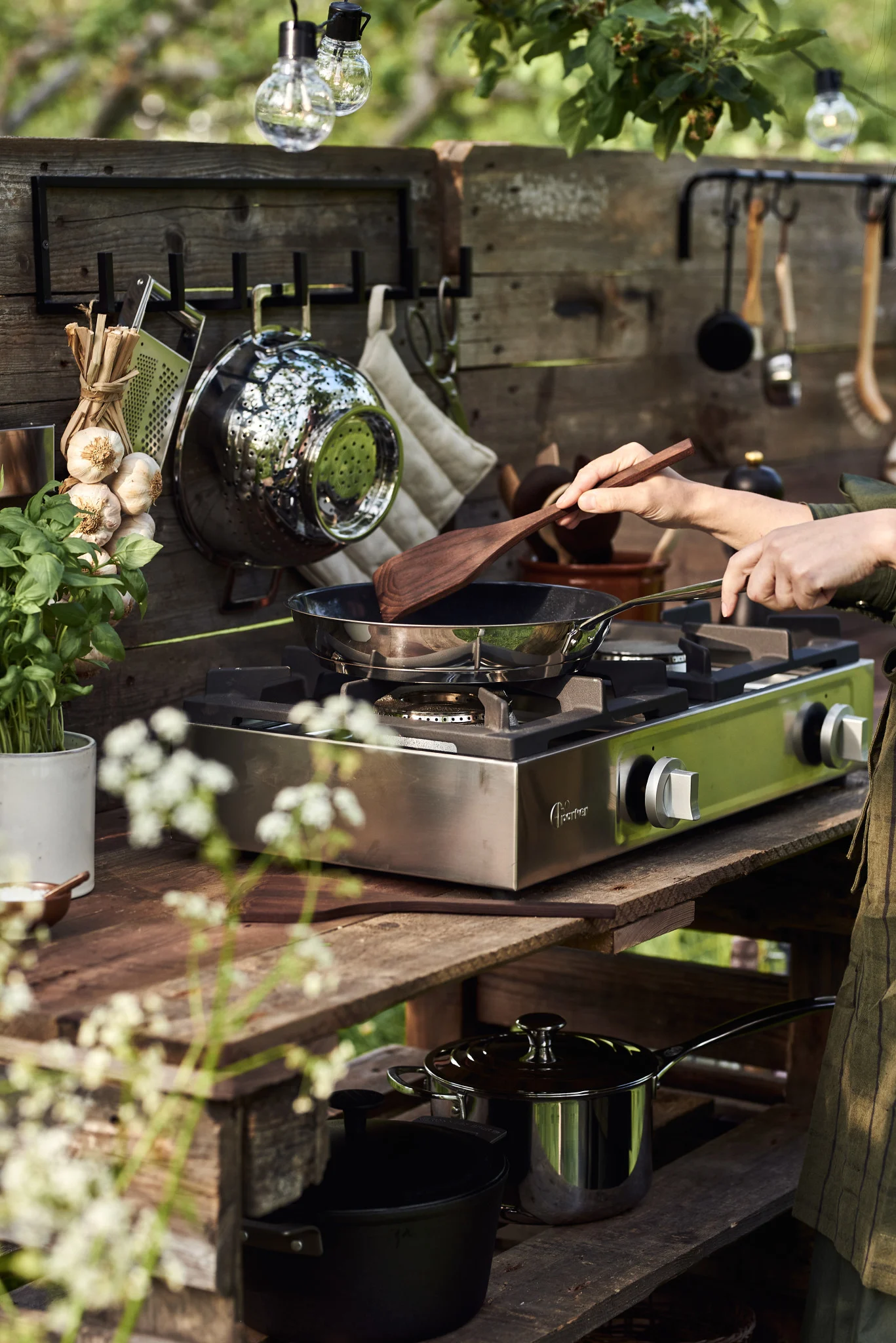 Outdoor cooking should be on any summer bucket list. Here you see someone cooking on a homemade outdoor kitchen. 