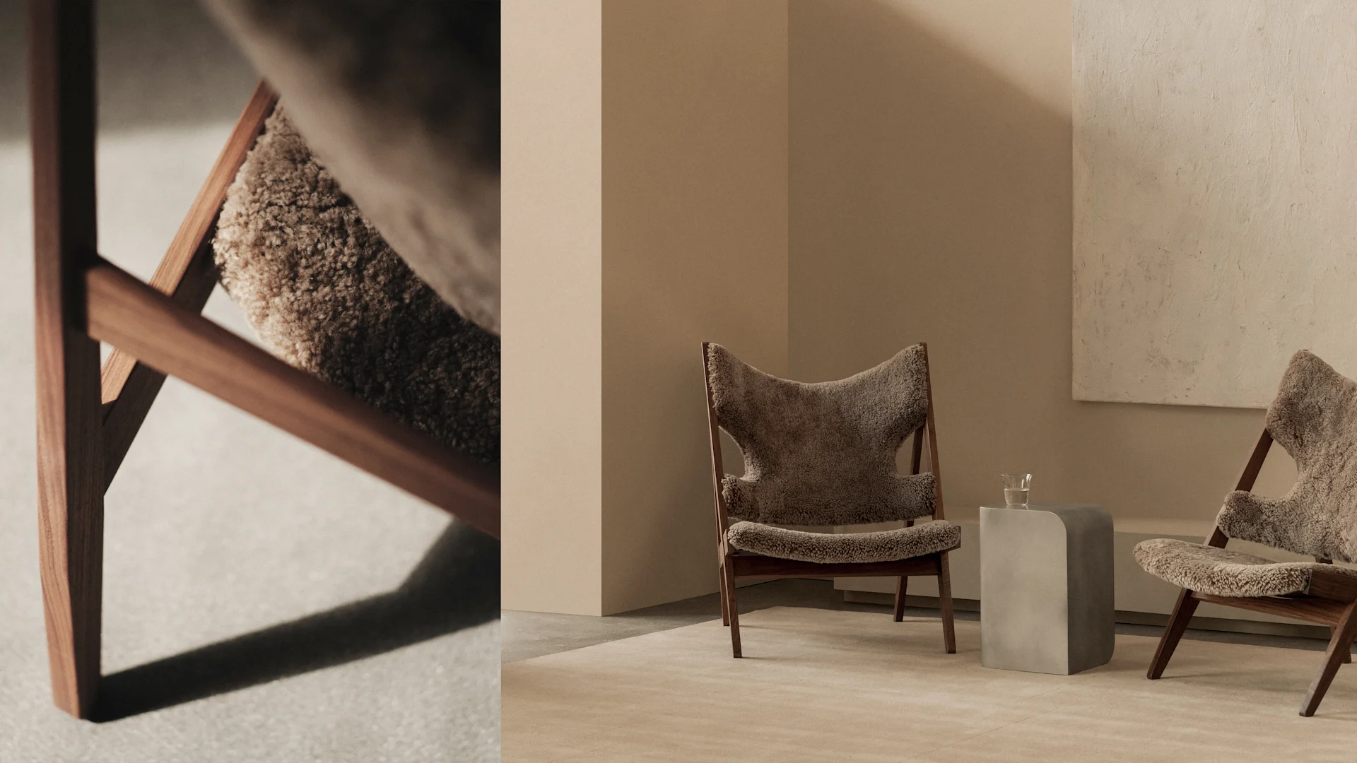 Two minimalist chairs with wooden frames and fluffy, beige upholstery in a neutral room. A concrete side table holds a glass.